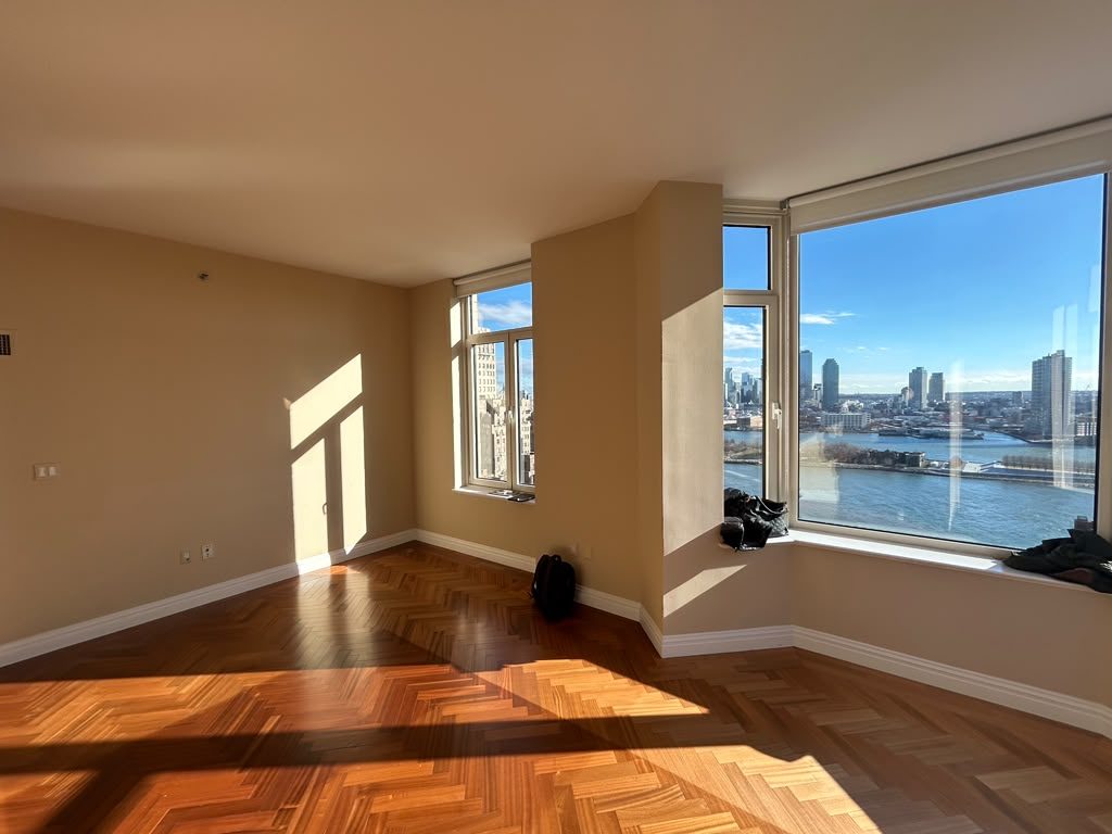 Refinished hardwood floor in a great room overlooking the river