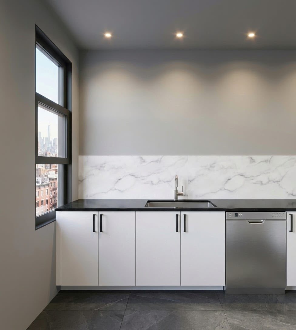 Kitchenette with marble backsplash and stainless appliances