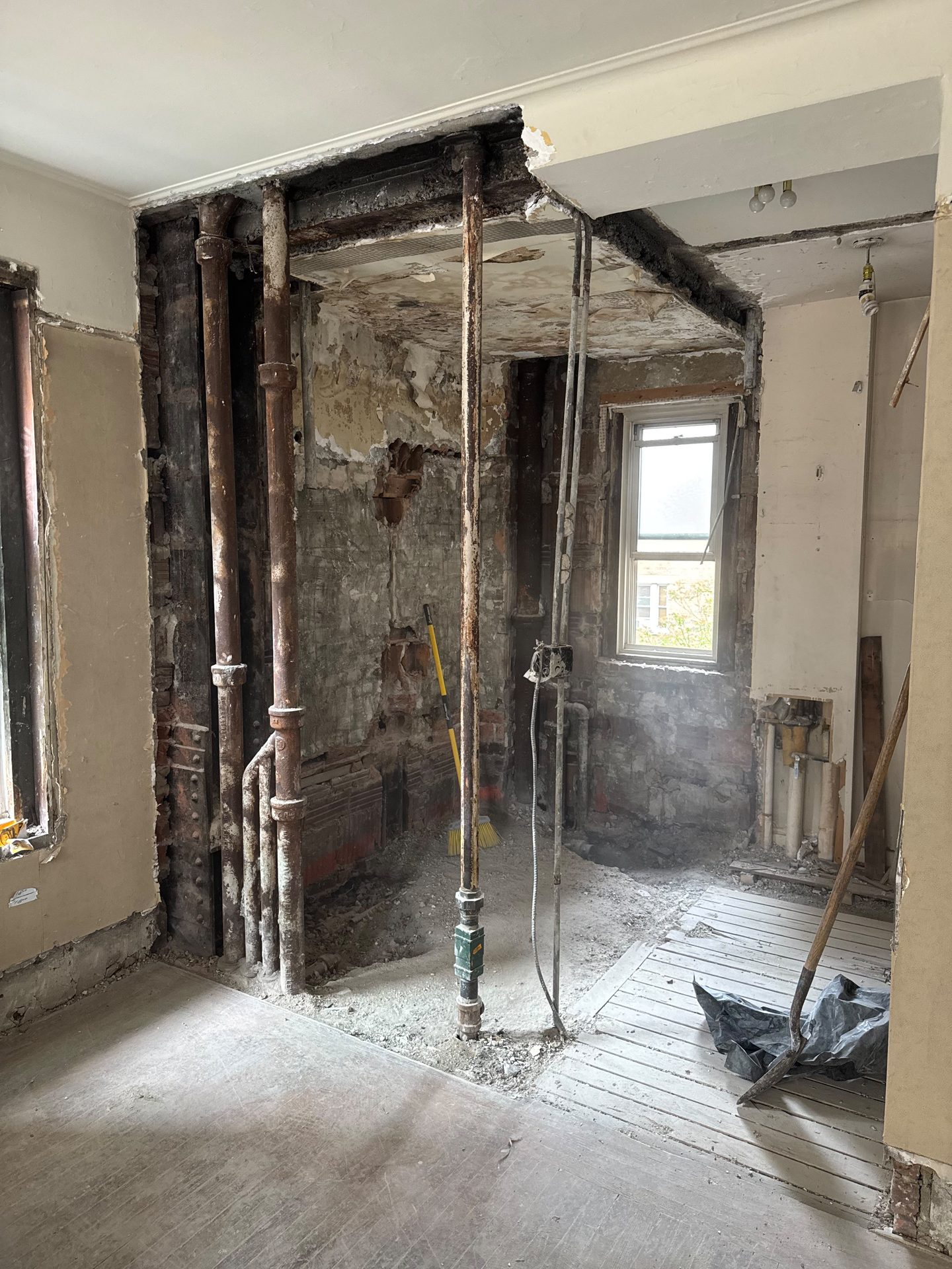 Demolition revealing the original brick and structure
