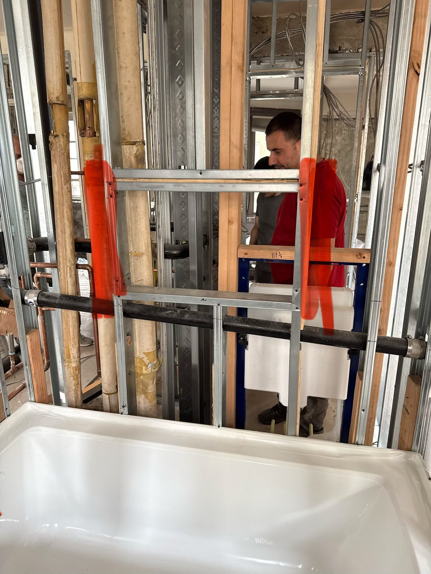 Plumbing rough-in for a bathroom renovation